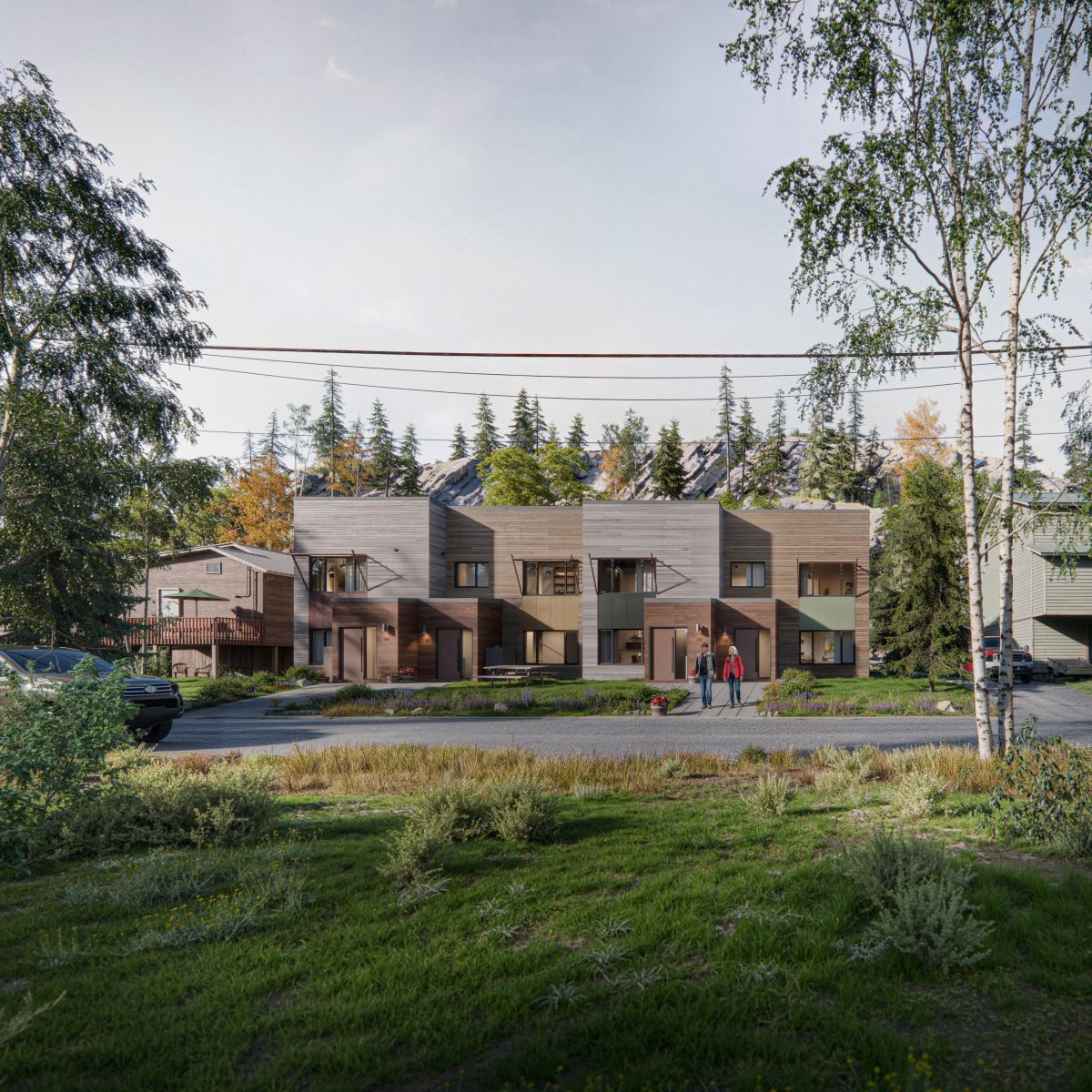 Rendu 3D d'un immeuble de maisons en rangée dotées d’une façade en panneaux de bois et de grandes fenêtres, dans un quartier résidentiel avec vue sur les montagnes. L'immeuble comprend plusieurs logements ainsi que des balcons privés et des entrées en retrait.